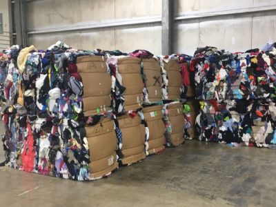 Goodwill Industries large piles of clothes